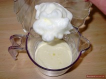 Beat egg whites until stiff and gradually add them into the whipped cream.