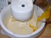 Stir the dough, add the rest of flour, salt, egg yolks with sugar and stir everything thou roughly.