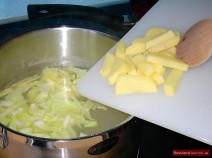 Bring meat stock (or water) to boil, put in potatoes and cabbage and let it simmer for about 15 minutes.