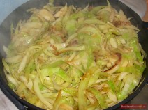 Grate cabbage or cut into thin stripes. Heat oil in a pan or skillet and sear cabbage shortly over high heat. Add caraway, season to taste with salt and pepper, cover and simmer for about 20 minutes.