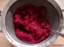 Place cranberries in the strainer over a bowl. Make juice drip into the bowl, stirring cranberry mash with a spoon. Set the bowl with cranberry juice aside.