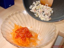 Cook rice in salted water until half-ready. Finely chop onions and sauté in oil or butter until translucent. Peel and grate carrots. Remove tomato skins and seeds. Finely chop tomatoes. Combine everything in a bowl.