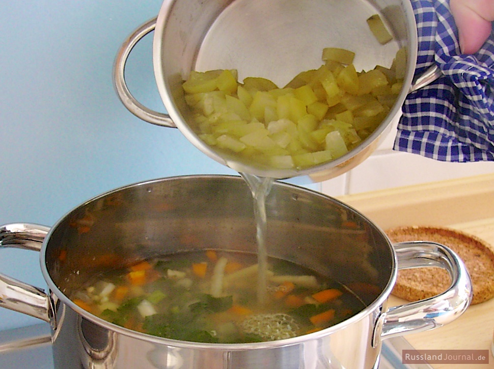 Add cooked pickled cucumbers with liquid. Check for taste. If Rassolnik is not salty enough, carefully add brine to taste.