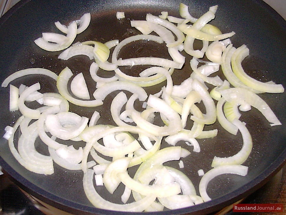 Preheat a pan, add oil or butter. Cut the onions in semi-rings and stir until transparent.
