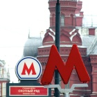 Two red Metro signs next to the Red Square in Moscow