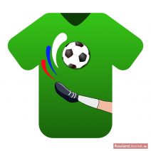 Grünes T-Shirt mit Fußball und einem kickenden Bein